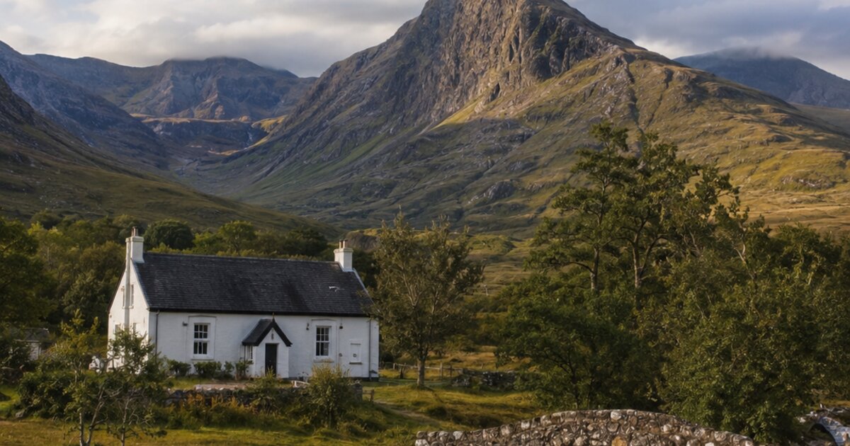 Glen Coe cottage with stone bridge and mountains, Scottish Highlands